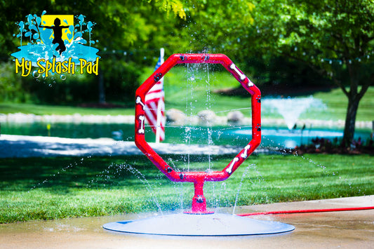 Dog Jump Hoop Water Park Feature by My Portable Splash Pad – red octagon-shaped hoop with bone and paw print design on white background.