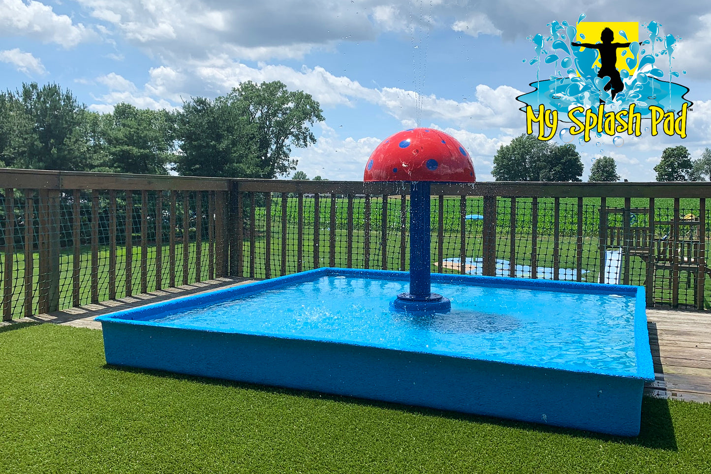 Portable Kid Wading Pool Kit by My Splash Pad with red mushroom water feature and blue splash basin on artificial turf deck.