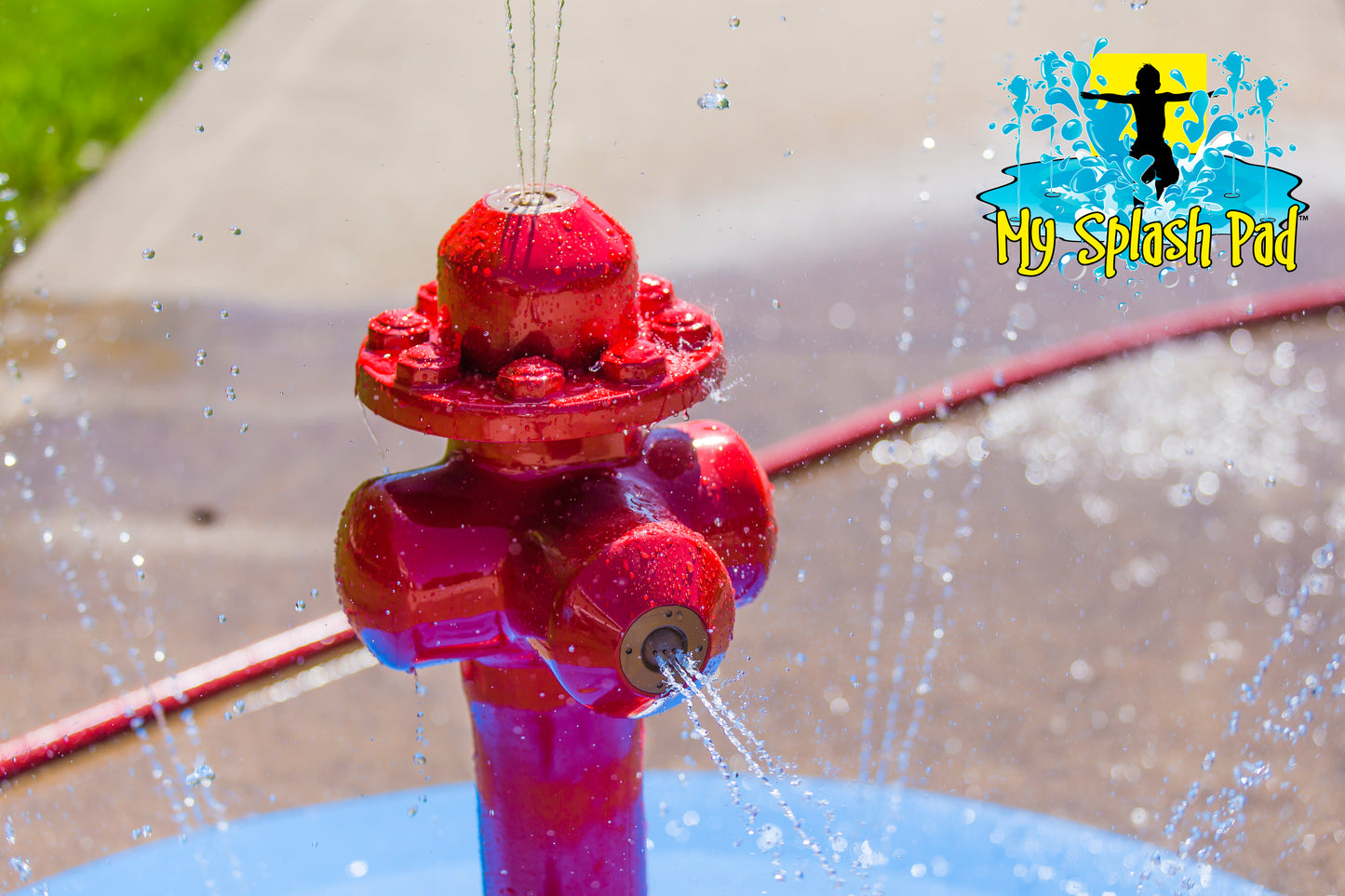 Fire Hydrant Portable Splash Pad feature with water spraying from side nozzles and top, durable backyard splash play equipment by My Splash Pad.