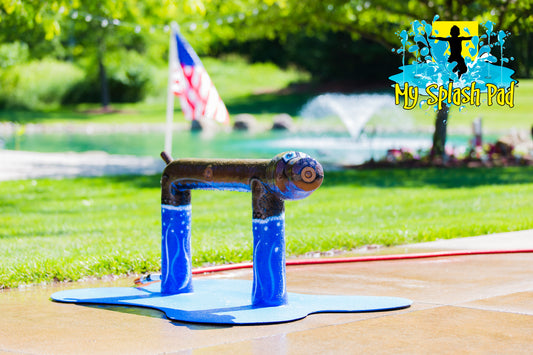 Standing Dog Water Play Features by My portable splash pad. Trees and grass in the background. Sunny day in Ohio.