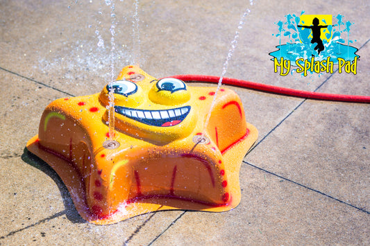 Starfish Mobile Spray and Play Features – yellow starfish splash pad with smiling face spraying water from nozzles.