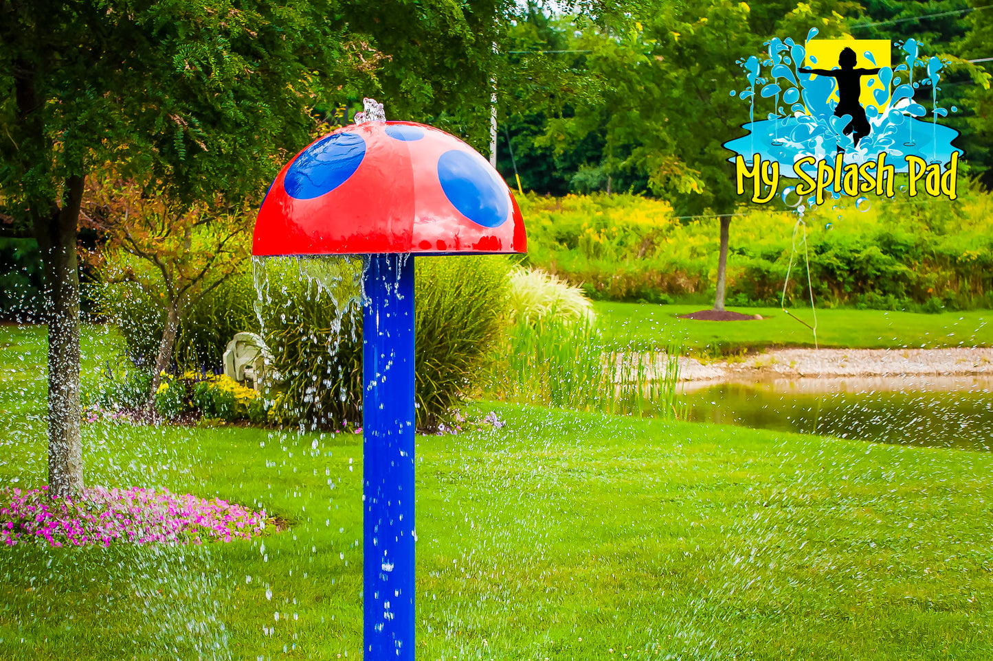 Mushroom Portable Splash Pad water play feature with red cap and blue polka dots spraying streams of water from the top, outdoor splash pad equipment.