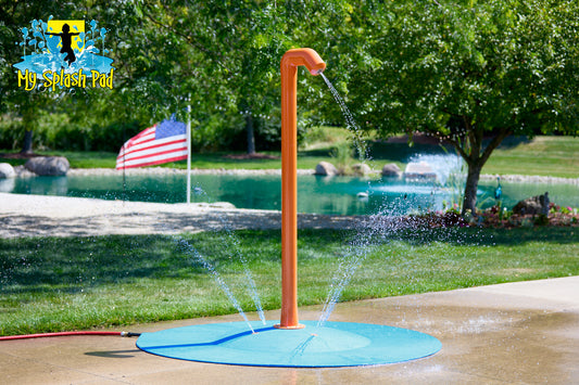 Rain Blaster Portable Splash Pad water play feature spraying streams of water outdoors, bright orange design for backyard fun by My Splash Pad.