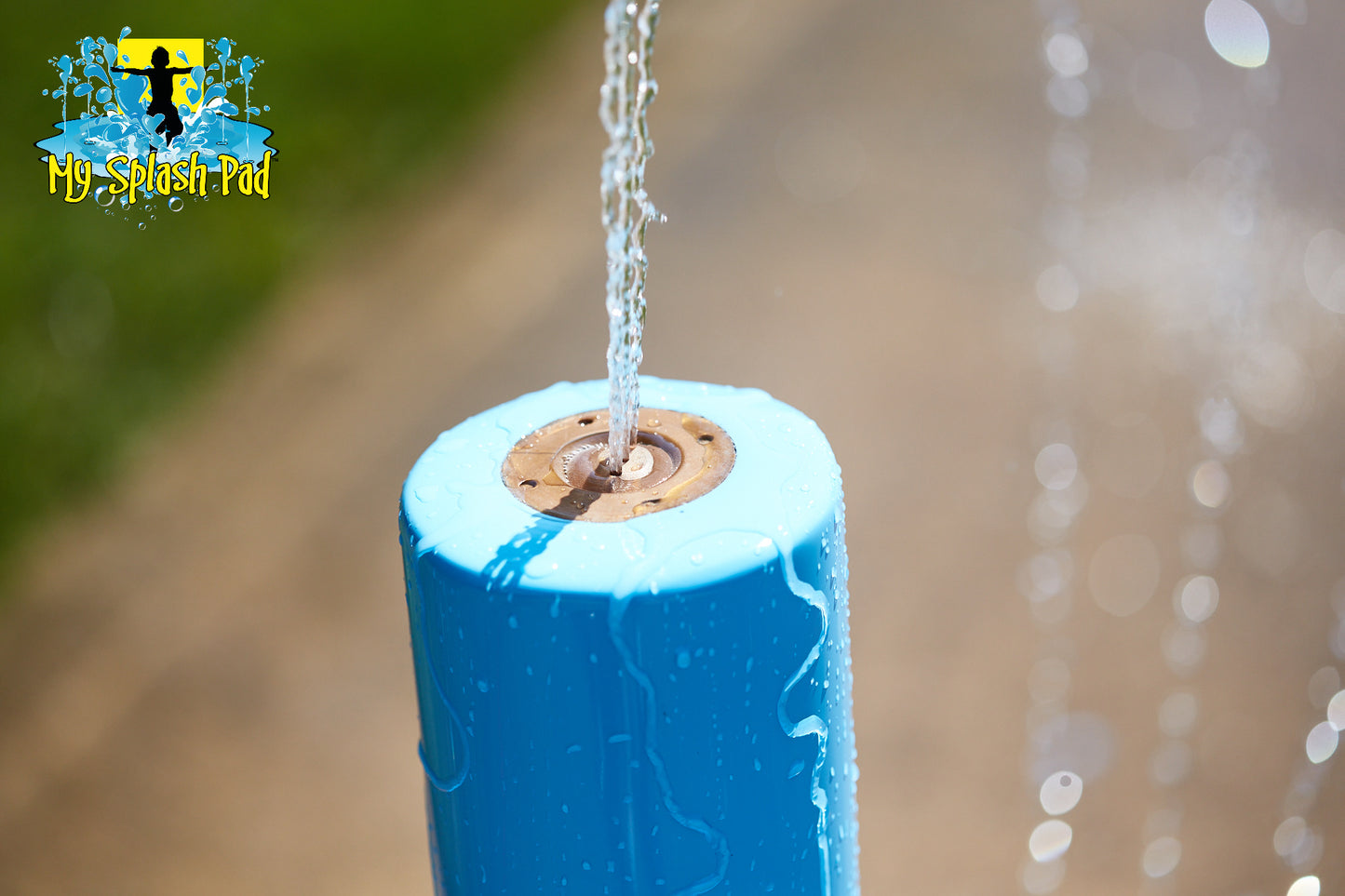 Close-up of the Small Rain Stick Portable Splash Pad Water Play Feature nozzle spraying water.