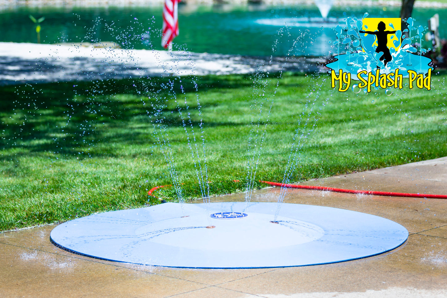 Portable splash pad with multiple water jets spraying upward, perfect for backyard summer fun and kids' outdoor play.