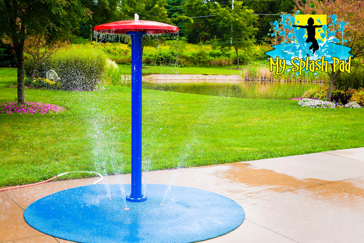 Umbrella Portable Splash Pad water play feature with a tall blue pole and red umbrella top spraying water, installed on a backyard splash pad.