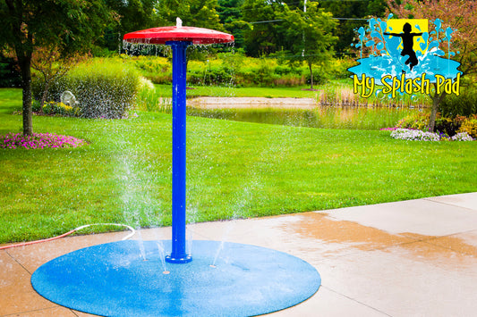 Umbrella Portable Splash Pad water play feature with a tall blue pole and red umbrella top spraying water, installed on a backyard splash pad.