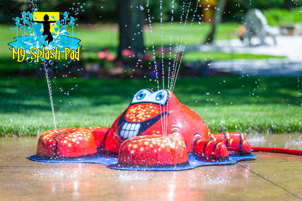 Crab Mobile Spray and Play Features – red crab splash pad water toy spraying water streams from claws and shell in backyard setting.