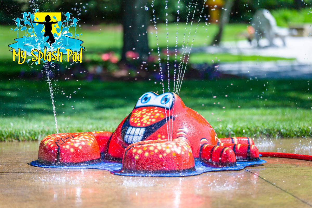 Crab Mobile Spray and Play Features – red crab splash pad water toy spraying water streams from claws and shell in backyard setting.