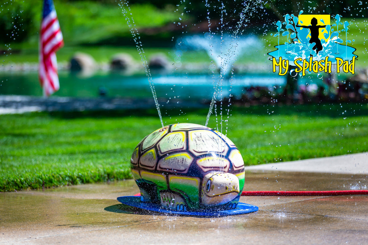 Medium Turtle Spray and Play Feature by My Splash Pad – interactive turtle splash pad water play structure spraying streams of water at an outdoor park.