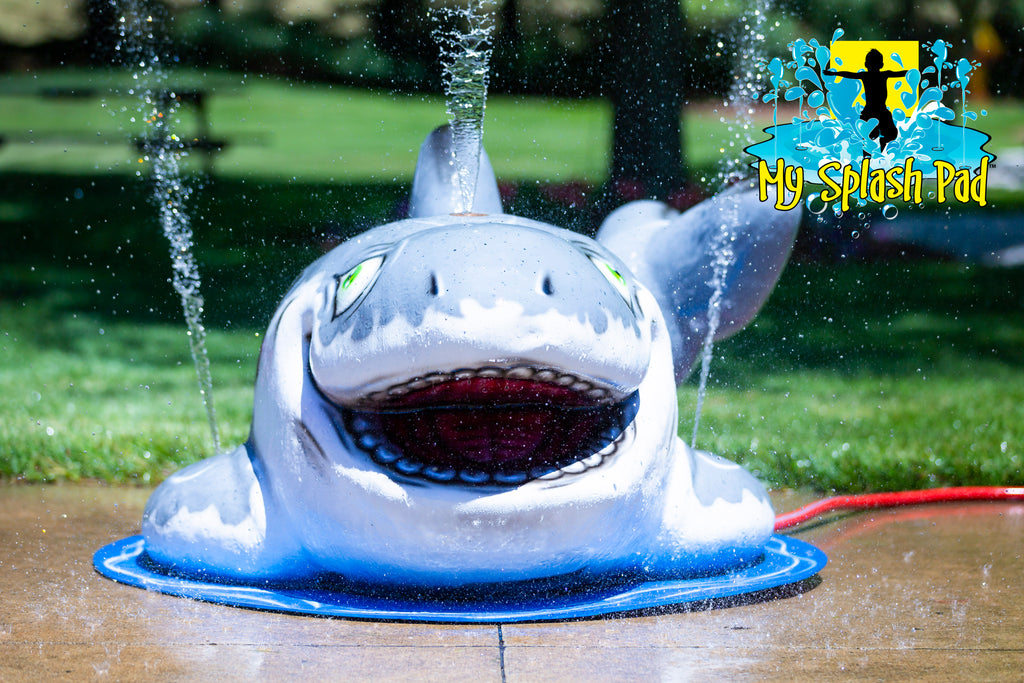 Shark Portable Play Feature by My Splash Pad – gray and blue shark water play structure spraying water, designed for children’s splash pads.