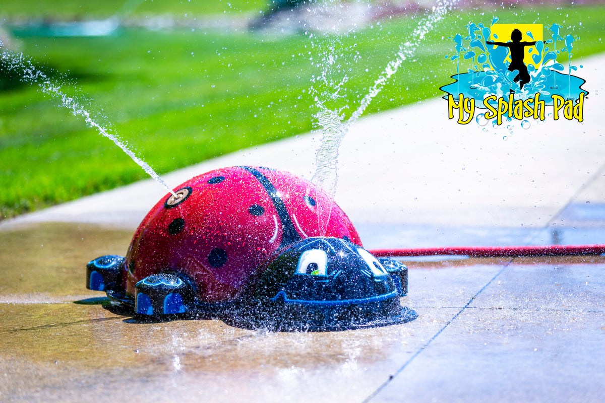 Small Ladybug Splash Pad water sprinkler feature spraying streams of water for kids’ outdoor play and backyard fun.